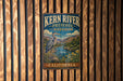 A vintage metal sign for Kern River Preserve Audubon in California, featuring a large heron in a natural setting.