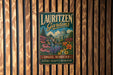 A vintage-style metal sign for Lauritzen Gardens in Omaha, Nebraska, featuring a garden scene with flowers and a building.