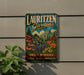 A vintage-style metal sign for Lauritzen Gardens in Omaha, Nebraska, featuring a colorful illustration of the gardens and a waterfall.