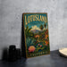 A vintage-style metal sign for "LOTUSLAND" in California, featuring a tropical landscape with palm trees, flowers, and a pond.