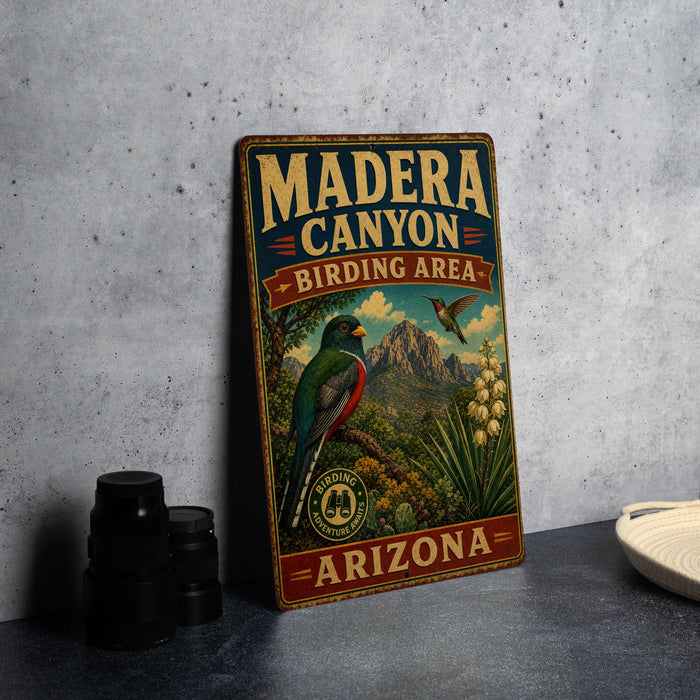 A vintage-style metal sign for Madera Canyon, Arizona, featuring a colorful illustration of a bird and the text "BIRDING AREA ARIZONA".