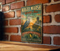 A vintage-style metal sign for the Magee Marsh Wildlife Area in Ohio, featuring a large blue heron and a sunset landscape.