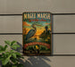 A vintage-style metal sign for the Magee Marsh Wildlife Area in Ohio, featuring an illustration of a heron and a sunset landscape.