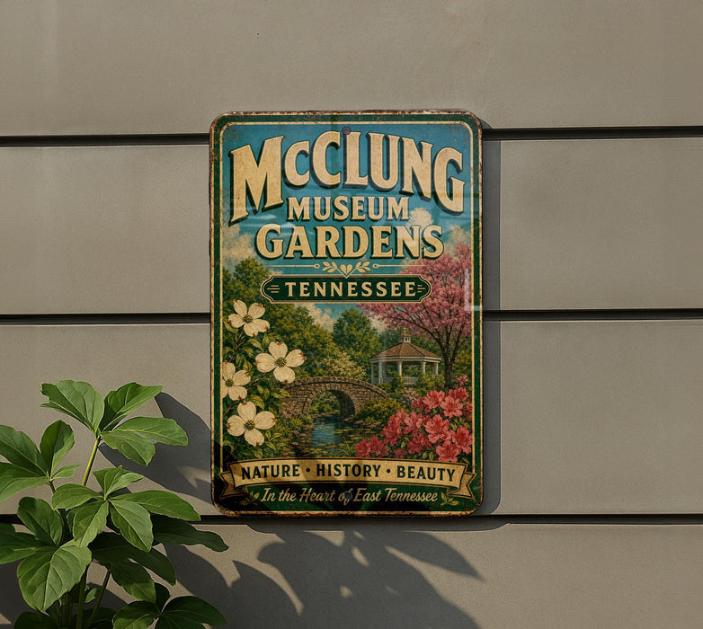 A vintage metal sign for the McCling Museum Gardens in Tennessee, featuring a scenic illustration of a garden with a gazebo and flowers.