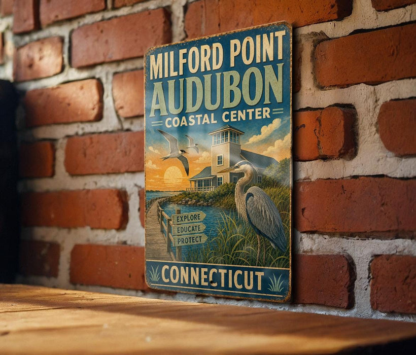 A vintage metal sign for Milford Point Audubon Coastal Center, featuring an illustration of a coastal scene with a crane and a bird.