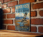 A vintage-style sign for the Monte Vista National Wildlife Refuge in Colorado, featuring a bird in flight and a scenic landscape.