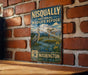 A vintage-style metal sign for the Nisqually National Wildlife Refuge in Washington, featuring an illustration of a bird and a mountain landscape.