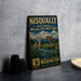 A vintage-style metal sign for the Nisqually National Wildlife Refuge, featuring an illustration of a bird and a mountain landscape.
