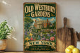 a vintage-style sign for the Old Westbury Gardens in New York, with a painting of a house and garden in the background. The sign is mounted on a wall, and there are some potted plants and kitchen utensils visible in the foreground.