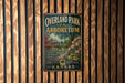 A vintage-style metal sign for "Overland Park Arboretum" in Kansas, featuring a scenic illustration of a garden with a gazebo and flowers.