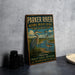 A vintage metal sign for the Parker River National Wildlife Refuge in Massachusetts, featuring an illustration of a heron and birds in a grassy area.