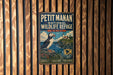 A vintage metal sign for the Petit Manan National Wildlife Refuge in Maine, featuring a puffin bird and a lighthouse.