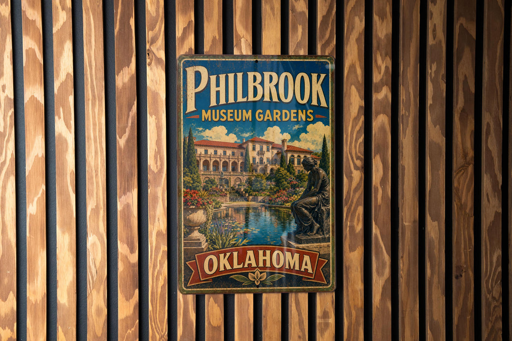 A vintage metal sign for Philbrook Museum Gardens in Oklahoma, featuring an illustration of a building and a statue.