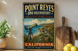 A vintage-style metal sign for Point Reyes Bird Observatory in California, featuring a telescope and a bird in a natural setting.
