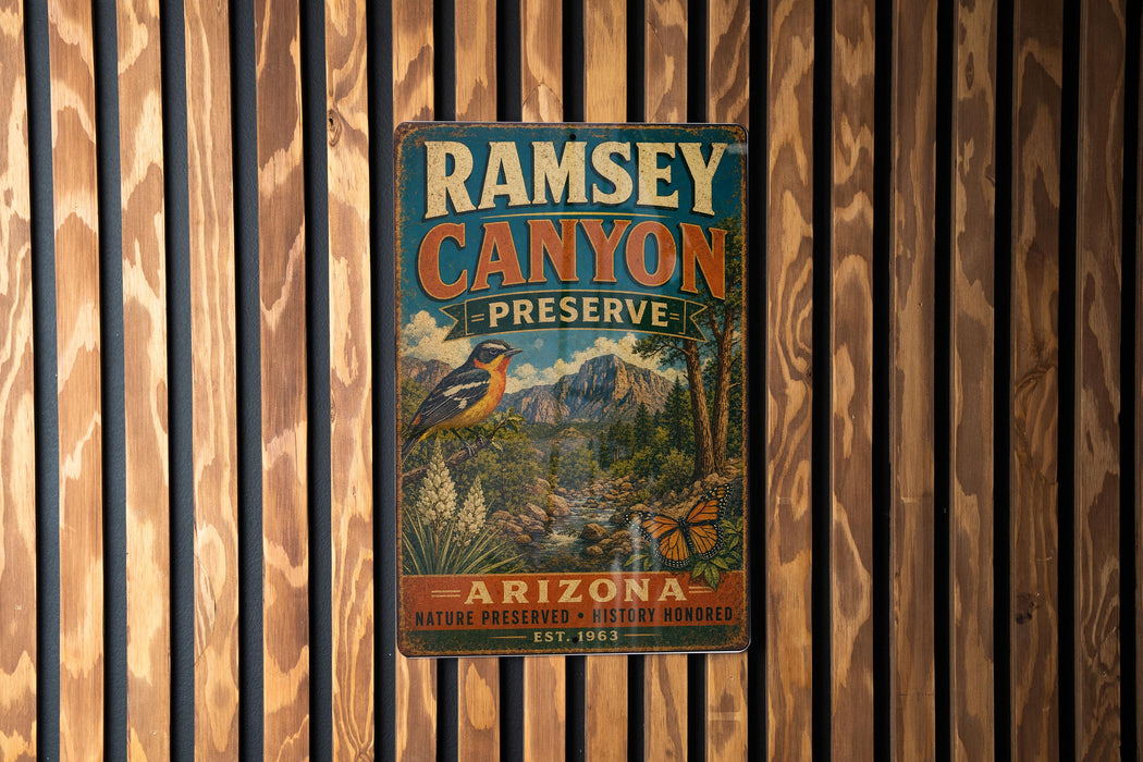 A vintage metal sign for Ramsey Canyon Preserve in Arizona, featuring a bird and a mountain landscape.