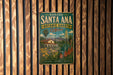 A vintage-style metal sign for the Rancho Santa Ana Botanic Garden in California, featuring a colorful illustration of a garden and a house.