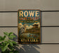 A vintage metal sign for the Rowe Sanctuary in Audubon, Nebraska, featuring a large bird and a wooden structure in the background.