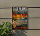 A vintage metal sign for the Salt Plains National Wildlife Refuge in Oklahoma, featuring an illustration of a bird and a sunset landscape.