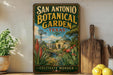 A vintage-style metal sign for the San Antonio Botanical Garden in Texas, featuring a colorful illustration of a garden landscape with a windmill and other plants.