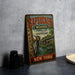 A vintage-style metal sign advertising "Sapsucker Woods" from the Cornell Lab of Ornithology, located in New York.