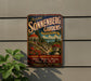 A vintage-style sign for Sonnenberg Gardens in Canadaauqua Lake, New York, featuring a scenic illustration of a garden with a gazebo and a lake in the background.