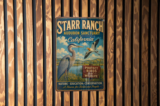 A vintage metal sign for the Starr Ranch Audubon Sanctuary in California, featuring an illustration of a heron and the text "PROTECT BIRDS AND WILDLIFE".