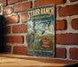 A vintage metal sign for the Starr Ranch Audubon Sanctuary in California, featuring an illustration of a heron and a sign that says "Protect Birds and Wildlife".