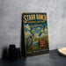 A vintage metal sign for the Starr Ranch Audubon Sanctuary in California, featuring illustrations of birds and wildlife, is displayed on a gray countertop next to a stack of camera lenses.