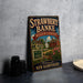 A vintage-style metal sign for the Strawberry Banke Museum Gardens in Portsmouth, New Hampshire, featuring an illustration of a historic house surrounded by flowers.