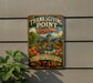 A metal sign with a colorful illustration of a garden and a waterfall, mounted on a wall.