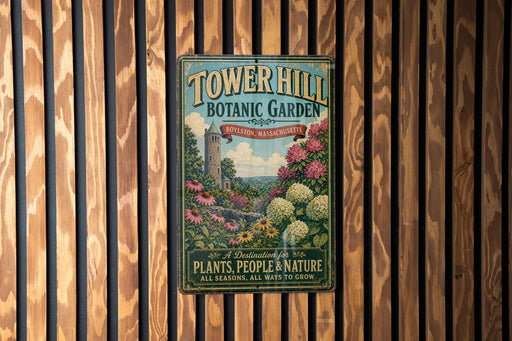 A vintage-style metal sign for Tower Hill Botanic Garden in Boston, Massachusetts, featuring a lush garden scene with a tower and flowers.