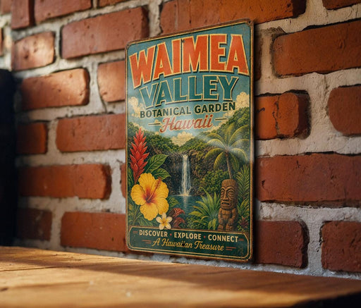 A vintage-style metal sign for the Waimea Valley Botanical Garden in Hawaii, featuring a tropical landscape with a waterfall and hibiscus flowers.