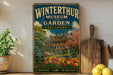 A vintage-style metal sign for the Winterthur Museum and Garden in Delaware, featuring an illustration of a historic building surrounded by a garden with tulips.