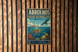 a vintage metal sign for Abrolhos Marine National Park in Brazil, depicting a seagull flying over a coral reef and a turtle swimming in the ocean.