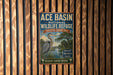 A vintage-style metal sign for the Ace Basin National Wildlife Refuge in South Carolina, featuring an illustration of a heron and a river.