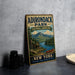A vintage-style sign for Adirondack Park, featuring a scenic landscape with a cabin, lake, and mountains.