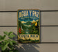 a vintage-style sign for the Agua y Paz Biosphere Reserve in Costa Rica, depicting a lush tropical landscape with a toucan and a waterfall.