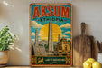a vintage-style poster of Aksum Ethiopia, with a colorful illustration of the city's landmarks and a sun in the sky. The poster is displayed on a wall, and there are some kitchen utensils, such as a wooden cutting board and a knife, as well as some decorative elements like a potted plant and a lemon, in the foreground.