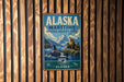 A vintage metal sign for the Alaska Maritime National Wildlife Refuge, featuring an illustration of a whale, seal, and mountains.