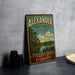 A vintage-style metal sign for Alexander State Forest in Louisiana, featuring a scenic landscape with pine trees, a river, and a cloudy sky.
