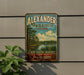 A vintage-style sign for Alexander State Forest in Louisiana, featuring a scenic landscape with pine trees and a body of water.