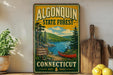 A vintage-style sign for Algonquin State Forest in Connecticut, featuring a scenic illustration of a lake, pine trees, and a canoe.