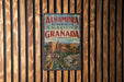 A vintage-style poster advertising Alhambra, Granada, Spain, featuring a scenic image of the Alhambra palace and gardens.