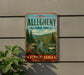 a vintage-style metal sign with a scenic forest landscape, mounted on a wall.