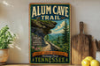 A vintage-style sign for the Alum Cave Trail in Great Smoky Mountains National Park, Tennessee, featuring a scenic mountain landscape with a winding trail.