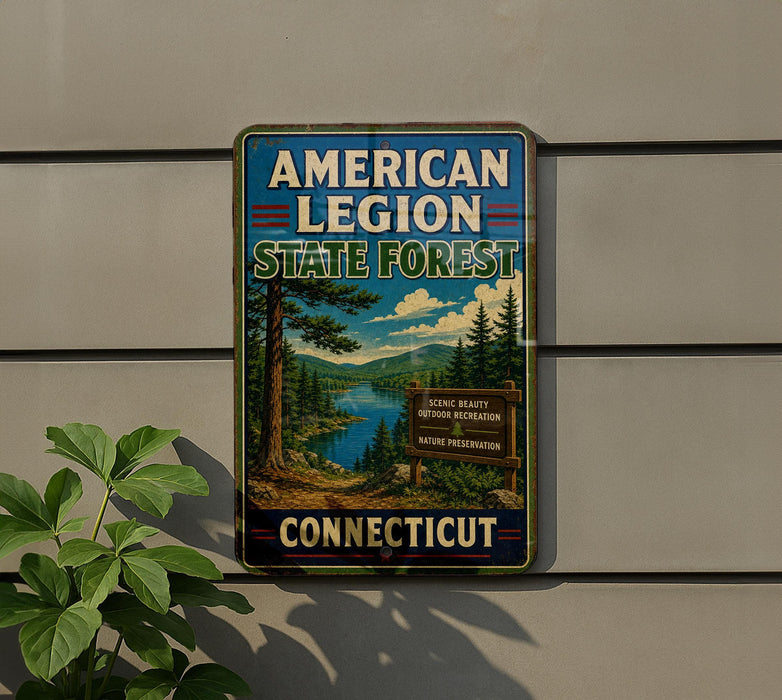 A vintage-style sign for the American Legion State Forest in Connecticut, featuring a scenic landscape with pine trees, a lake, and mountains.