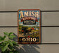 a vintage-style sign for Amish Country Heritage Landscape, which is located in Ohio.