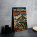 A vintage-style metal sign with the text "Ancient Building Complex in the Wudang Mountains" and "China" printed on it, along with a depiction of a Chinese temple. The sign is placed on a gray countertop next to some black camera lenses.