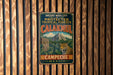 A vintage metal sign advertising the ancient Maya city of Calakmul, Mexico, featuring a jungle scene with a jaguar.