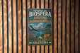 A vintage metal sign with the text "RESERVA DE BIOSFERA ANDINO NORPATAGONICA ARGENTINA" and an illustration of a mountain, a bird, and a deer.